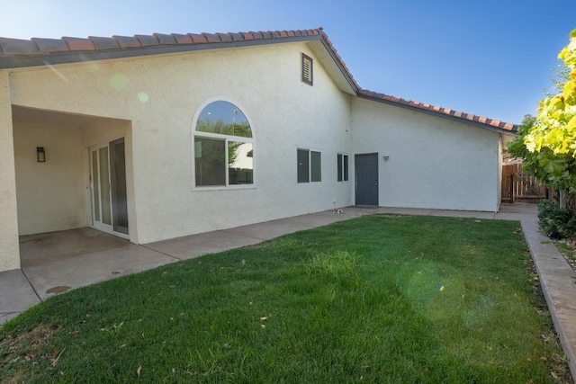 318 San Madele Ave, Coalinga, CA 93210 - back of property with stucco siding, a patio area, and a tile roof