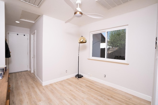 318 San Madele Ave, Coalinga, CA 93210 - spare room featuring wood finished floors, a ceiling fan, and attic access