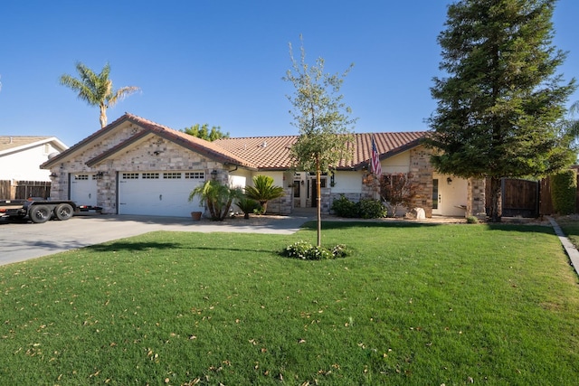 318 San Madele Ave, Coalinga, CA 93210 - view of front facade featuring stone siding, a garage, concrete driveway, a tiled roof, and a front yard
