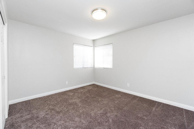 4727 E Alamos Unit 118, Fresno, CA 93726 - spare room featuring dark carpet and baseboards