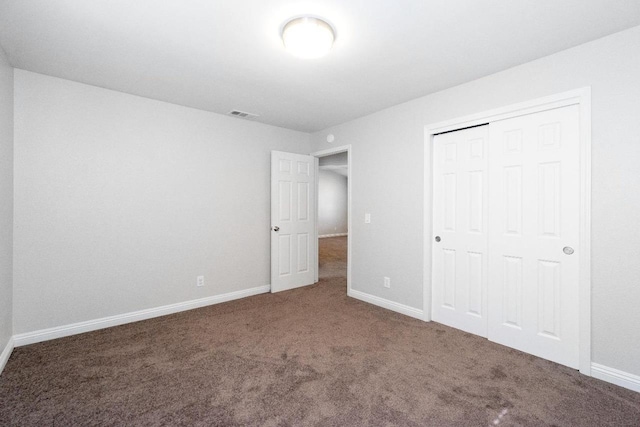 4727 E Alamos Unit 118, Fresno, CA 93726 - unfurnished bedroom featuring carpet floors and a closet