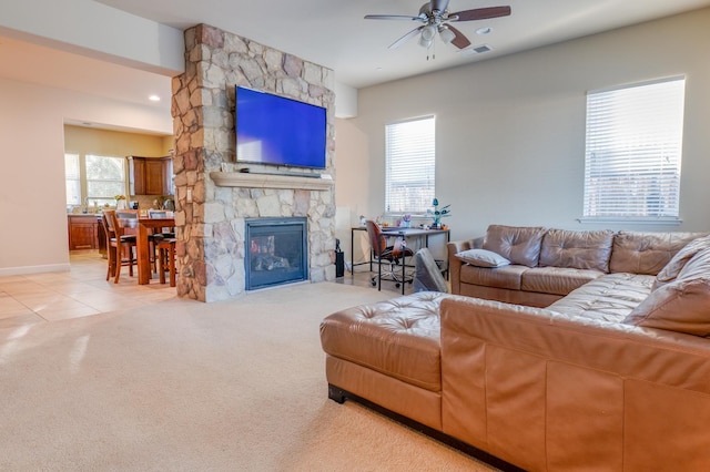 7951 N Fine Ave, Fresno, CA 93720 - living area featuring a ceiling fan, light carpet, a fireplace, and light tile patterned floors