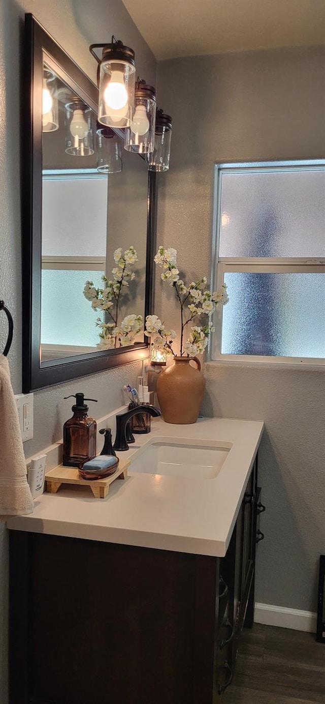 917 E Fountain Way, Fresno, CA 93704 - bathroom with vanity and wood finished floors