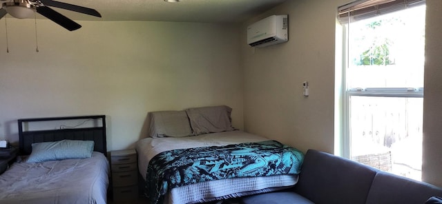 917 E Fountain Way, Fresno, CA 93704 - bedroom with an AC wall unit and a ceiling fan