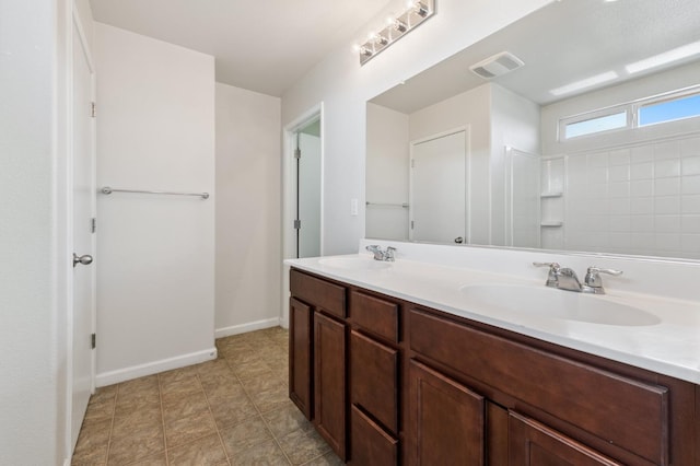 376 S Knox St, Madera, CA 93638 - full bathroom featuring double vanity and baseboards