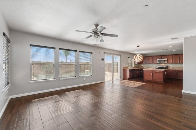 376 S Knox St, Madera, CA 93638 - unfurnished living room featuring dark wood finished floors, ceiling fan, and recessed lighting