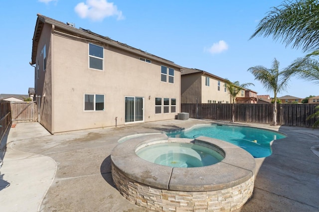 376 S Knox St, Madera, CA 93638 - view of swimming pool featuring a patio area, a fenced backyard, and a pool with connected hot tub