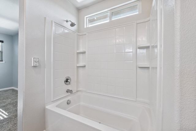 376 S Knox St, Madera, CA 93638 - bathroom featuring  shower combination, healthy amount of natural light, and a textured wall