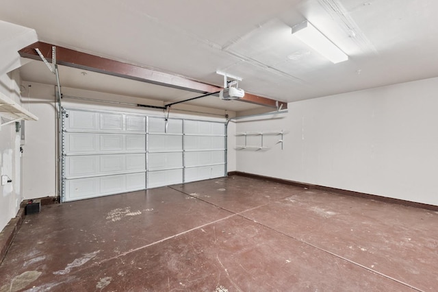 376 S Knox St, Madera, CA 93638 - garage featuring baseboards and a garage door opener