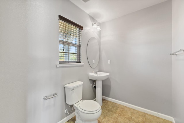 376 S Knox St, Madera, CA 93638 - half bathroom featuring toilet and baseboards