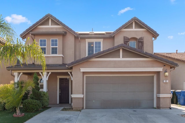 376 S Knox St, Madera, CA 93638 - view of front of house featuring driveway, stucco siding, and a tile roof