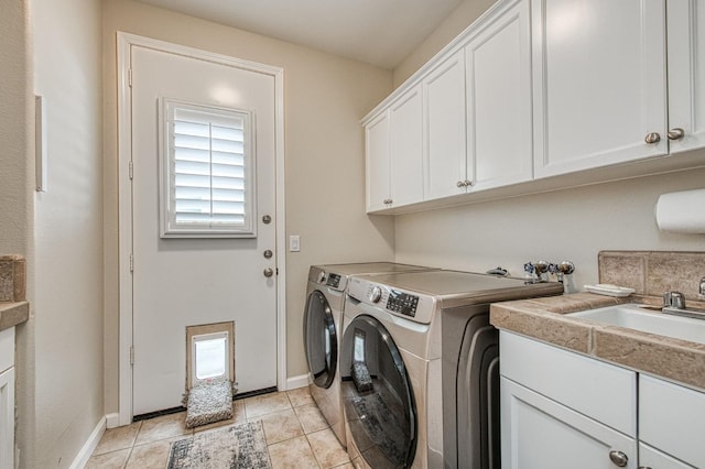 4626 N Arrow Ridge Way, Clovis, CA 93619 - washroom with cabinet space, washing machine and clothes dryer, plenty of natural light, and light tile patterned flooring
