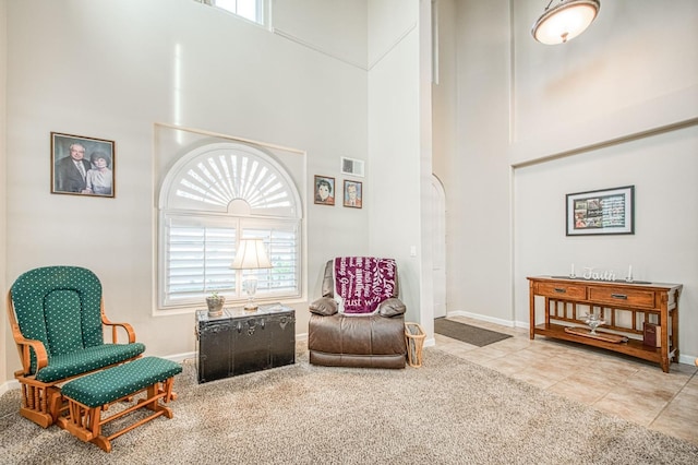 4626 N Arrow Ridge Way, Clovis, CA 93619 - living area featuring a towering ceiling, carpet floors, and tile patterned floors