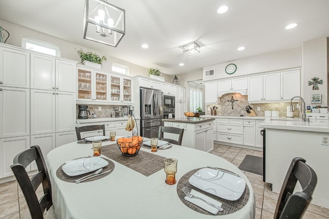 4626 N Arrow Ridge Way, Clovis, CA 93619 - dining space featuring light tile patterned flooring, recessed lighting, and a chandelier