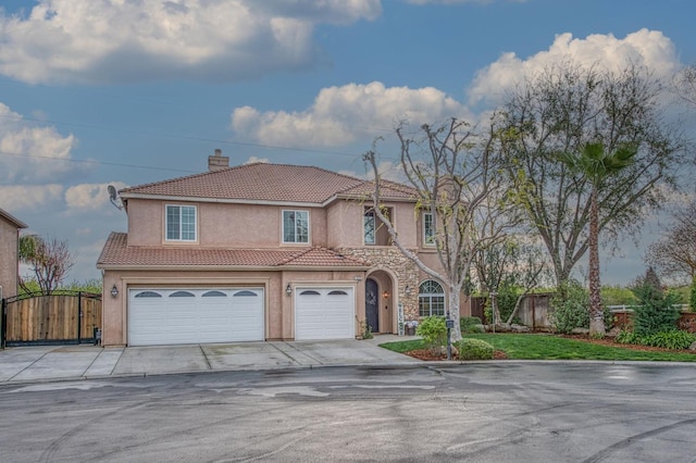 4626 N Arrow Ridge Way, Clovis, CA 93619 - mediterranean / spanish-style home with stucco siding, an attached garage, a tiled roof, a chimney, and concrete driveway