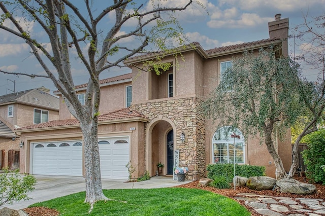 4626 N Arrow Ridge Way, Clovis, CA 93619 - view of front facade with driveway, stucco siding, a chimney, stone siding, and a garage