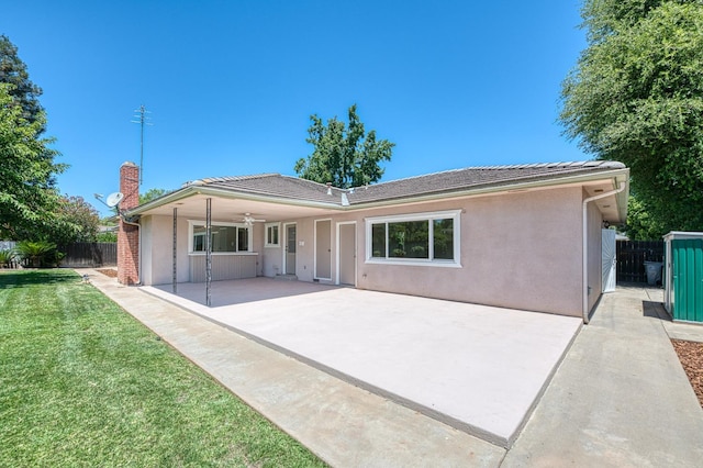 1445 W Ellery Way, Fresno, CA 93711 - back of house featuring a ceiling fan, a patio area, a chimney, and stucco siding
