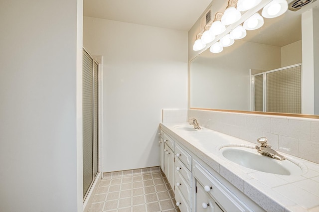 1445 W Ellery Way, Fresno, CA 93711 - full bathroom featuring double vanity, a shower stall, and tasteful backsplash