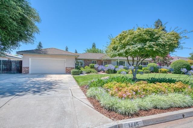 1445 W Ellery Way, Fresno, CA 93711 - single story home with driveway, stucco siding, and a garage