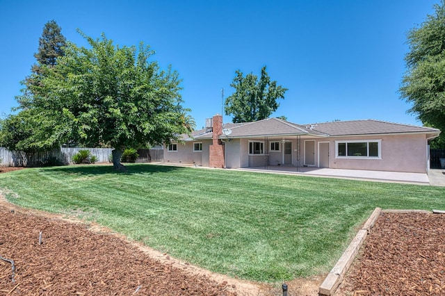 1445 W Ellery Way, Fresno, CA 93711 - rear view of property with a fenced backyard, a patio area, stucco siding, and a chimney