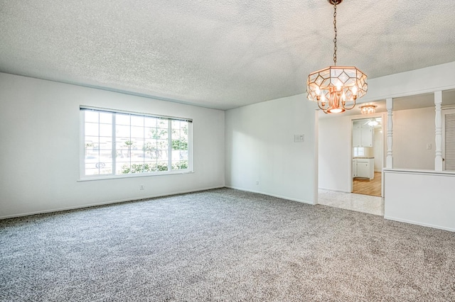 1445 W Ellery Way, Fresno, CA 93711 - empty room with a chandelier, a textured ceiling, and light colored carpet