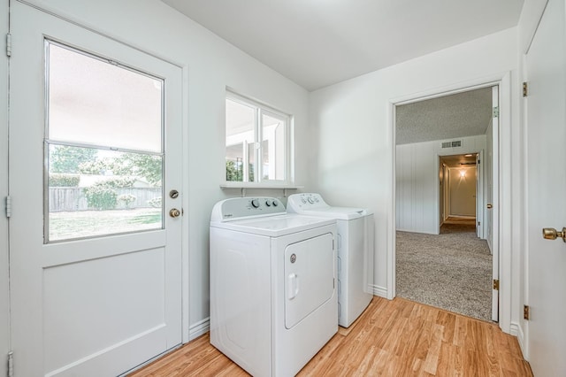 1445 W Ellery Way, Fresno, CA 93711 - laundry room featuring washing machine and dryer, light wood-style flooring, and plenty of natural light
