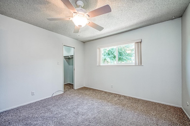 1445 W Ellery Way, Fresno, CA 93711 - unfurnished bedroom featuring carpet floors, a textured ceiling, a closet, a ceiling fan, and a spacious closet