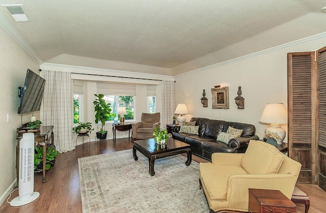 3012 Fairmont Ct, Madera, CA 93637 - living area with crown molding, wood finished floors, and a textured ceiling