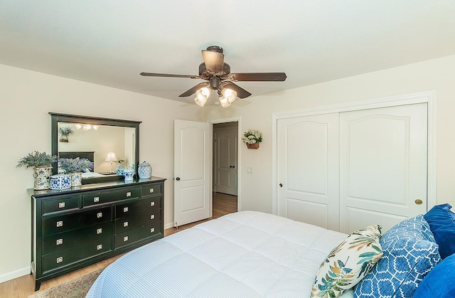 3012 Fairmont Ct, Madera, CA 93637 - bedroom featuring wood finished floors, a closet, and a ceiling fan