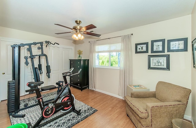 3012 Fairmont Ct, Madera, CA 93637 - exercise area with light wood-style floors and a ceiling fan