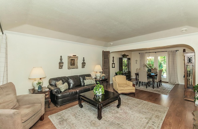 3012 Fairmont Ct, Madera, CA 93637 - living area with a textured ceiling, arched walkways, dark wood-style flooring, and crown molding