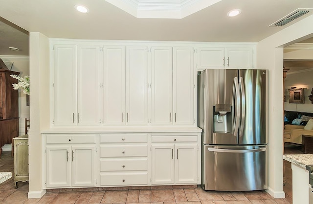 3012 Fairmont Ct, Madera, CA 93637 - kitchen with stainless steel fridge with ice dispenser, crown molding, recessed lighting, and white cabinets