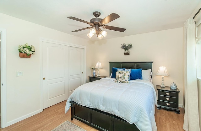 3012 Fairmont Ct, Madera, CA 93637 - bedroom with light wood-style flooring, a closet, and ceiling fan