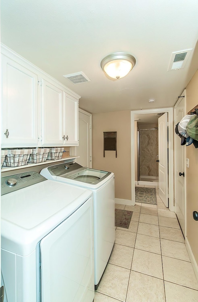3012 Fairmont Ct, Madera, CA 93637 - washroom with independent washer and dryer, cabinet space, and light tile patterned floors