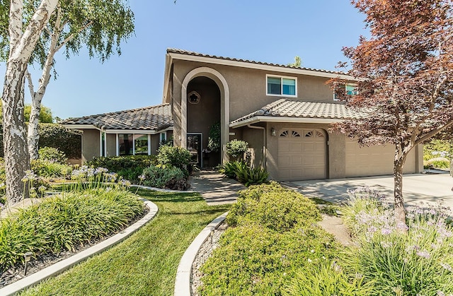 3012 Fairmont Ct, Madera, CA 93637 - mediterranean / spanish-style house featuring stucco siding, driveway, and a tile roof
