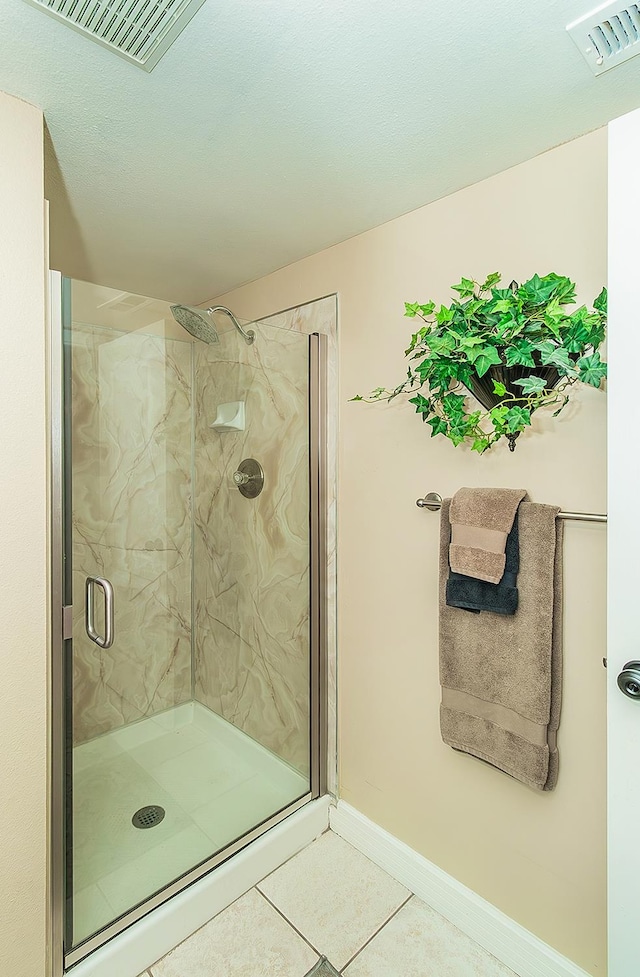 3012 Fairmont Ct, Madera, CA 93637 - full bath with a marble finish shower and tile patterned floors