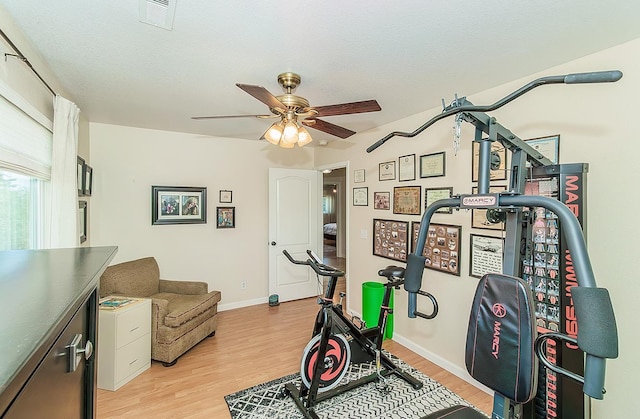 3012 Fairmont Ct, Madera, CA 93637 - workout room featuring a ceiling fan and light wood-style flooring