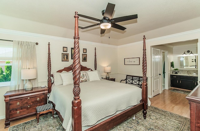 3012 Fairmont Ct, Madera, CA 93637 - bedroom with wood finished floors, crown molding, ensuite bathroom, and a ceiling fan