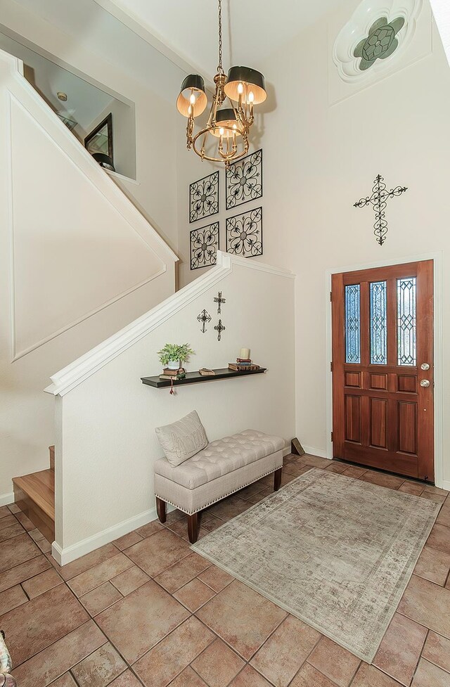 3012 Fairmont Ct, Madera, CA 93637 - foyer featuring stairs, a chandelier, and a high ceiling
