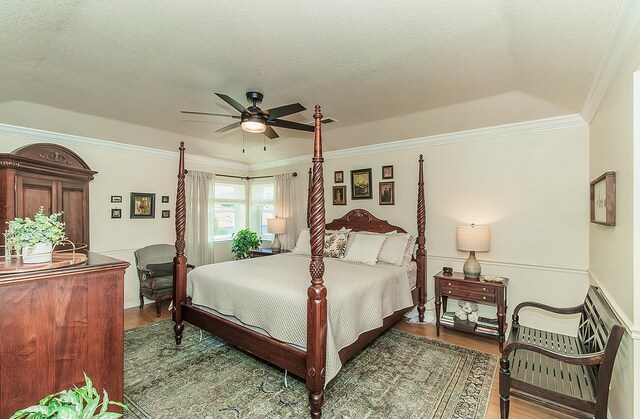 3012 Fairmont Ct, Madera, CA 93637 - bedroom with wood finished floors, crown molding, a textured ceiling, and a ceiling fan