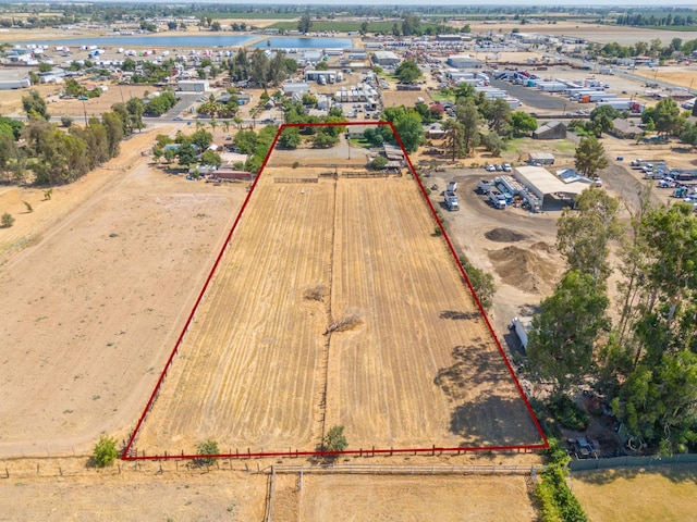 3684 W Belmont Ave, Fresno, CA 93722 - aerial view of property and surrounding area featuring property parcel outlined and a large body of water