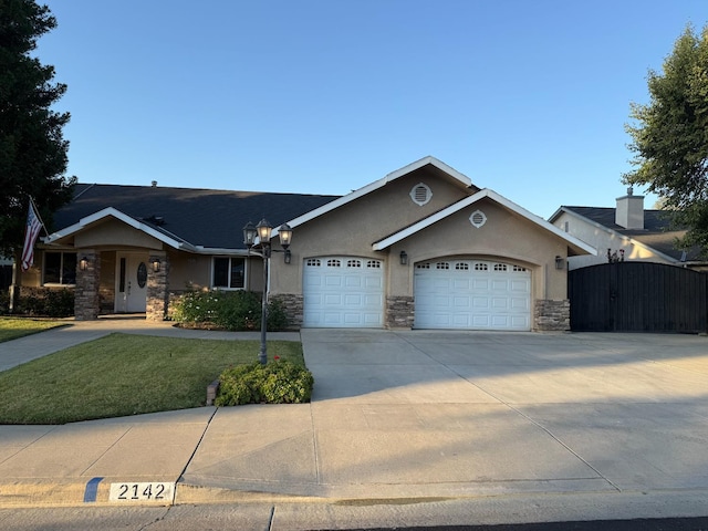 2142 Austin Ave, Clovis, CA 93611 - single story home featuring stucco siding, stone siding, a garage, and driveway
