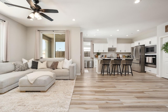 1275 Traverse Dr S, Madera, CA 93636 - living room featuring recessed lighting, light wood-type flooring, and a ceiling fan