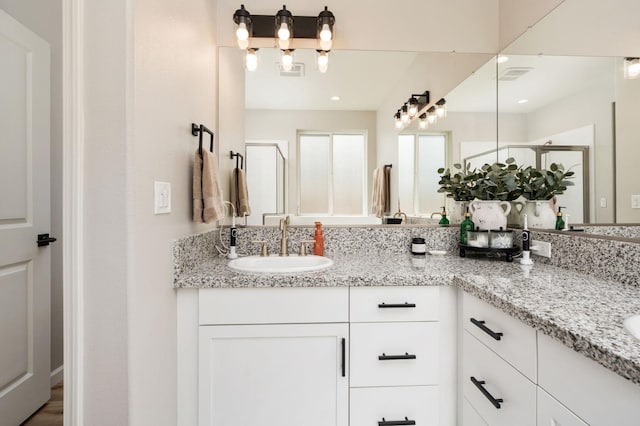 1275 Traverse Dr S, Madera, CA 93636 - bathroom with double vanity and a shower stall
