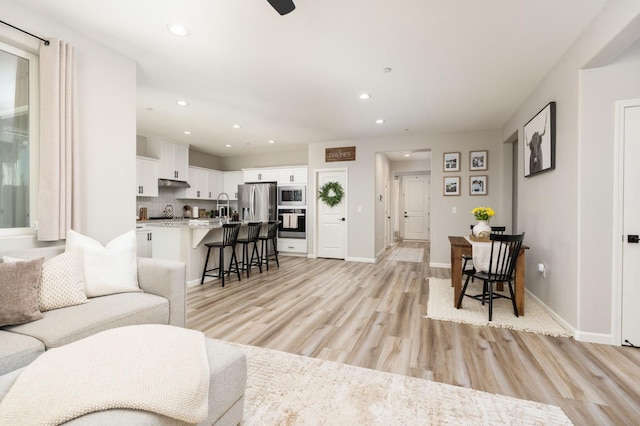 1275 Traverse Dr S, Madera, CA 93636 - living area with light wood-style floors and recessed lighting