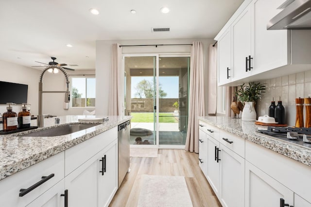 1275 Traverse Dr S, Madera, CA 93636 - kitchen featuring ventilation hood, light wood-type flooring, ceiling fan, white cabinets, and recessed lighting
