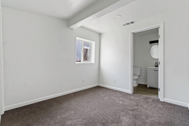 124 E 4th St, Hanford, CA 93230 - unfurnished bedroom with carpet and connected bathroom