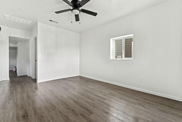 124 E 4th St, Hanford, CA 93230 - spare room featuring dark wood-type flooring and a ceiling fan