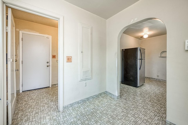 4740 E Washington Ave, Fresno, CA 93702 - spare room featuring arched walkways and light floors