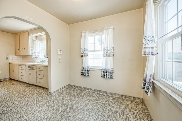 4740 E Washington Ave, Fresno, CA 93702 - dining space featuring arched walkways and baseboards